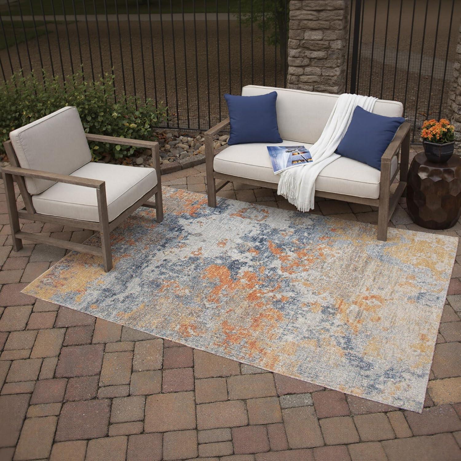 imageSignature Design by Ashley Wraylen 8 x 10 Low Pile Boho Abstract Rug Orange ampamp Blue710 x 10 Rectangular