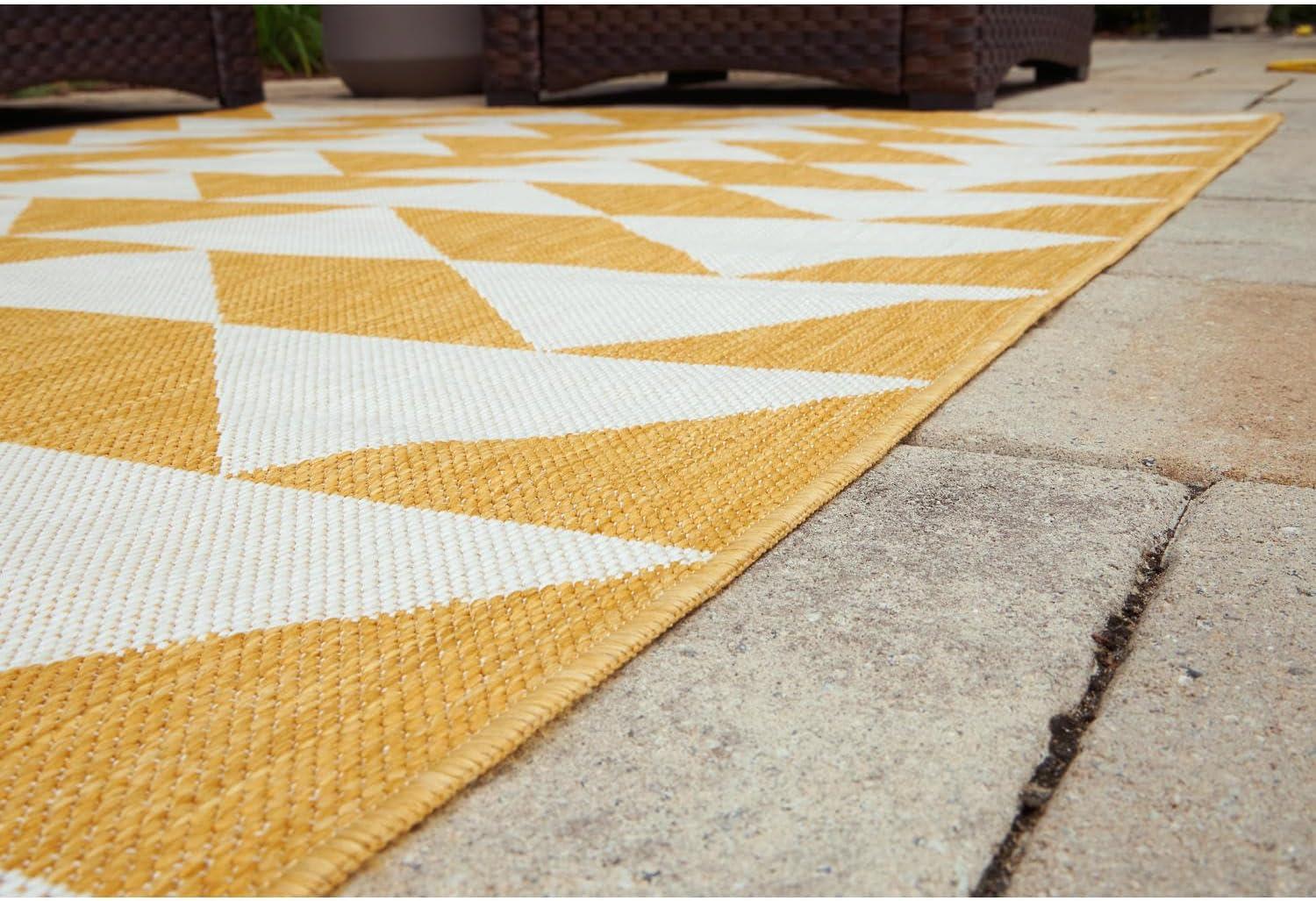 imageSignature Design by Ashley Thomley Casual IndoorOutdoor Geometric 5 x 7 Rug with Non Slip Backing Yellow ampamp White53 x 611 Rectangular