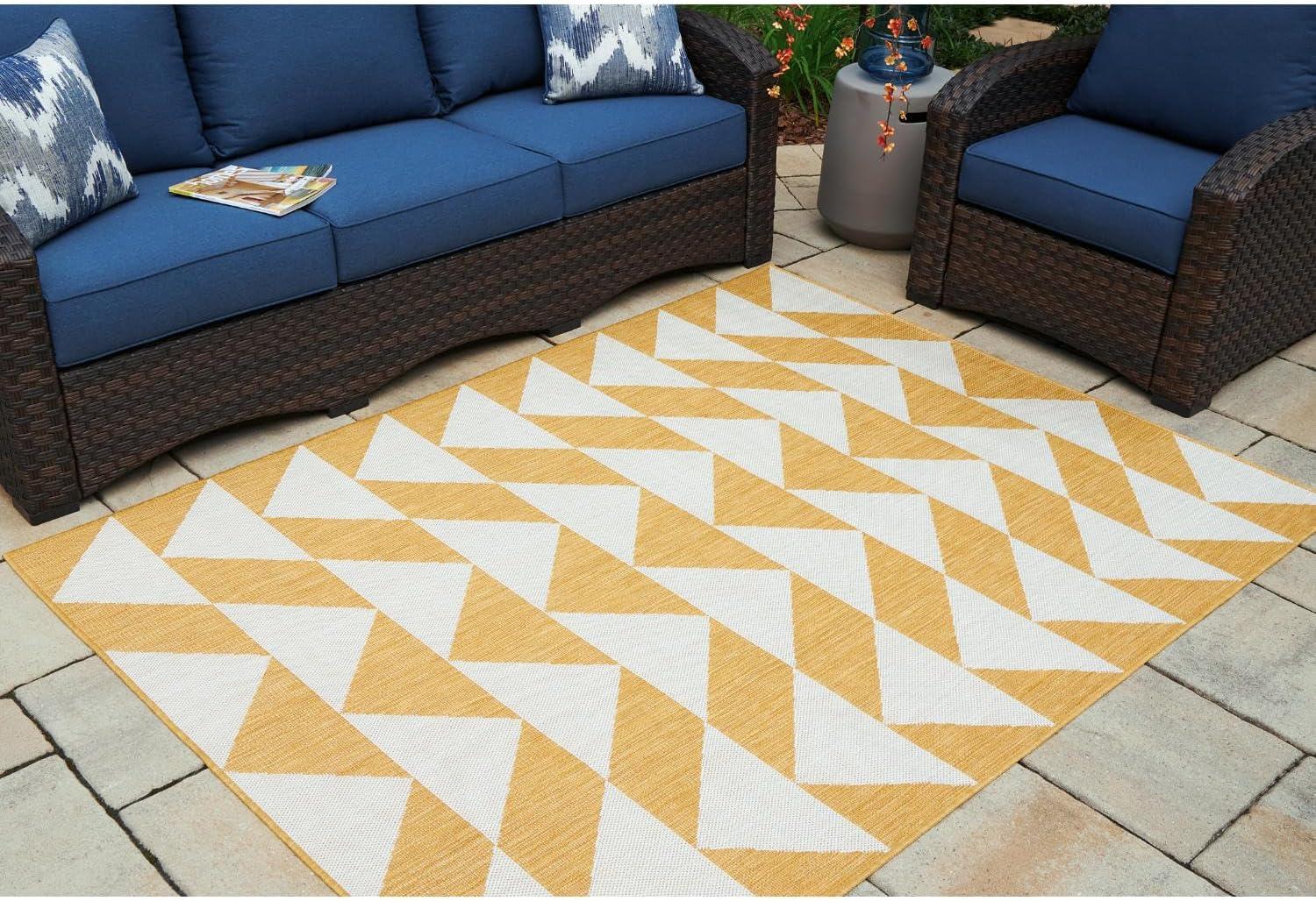 imageSignature Design by Ashley Thomley Casual IndoorOutdoor Geometric 5 x 7 Rug with Non Slip Backing Yellow ampamp White53 x 611 Rectangular