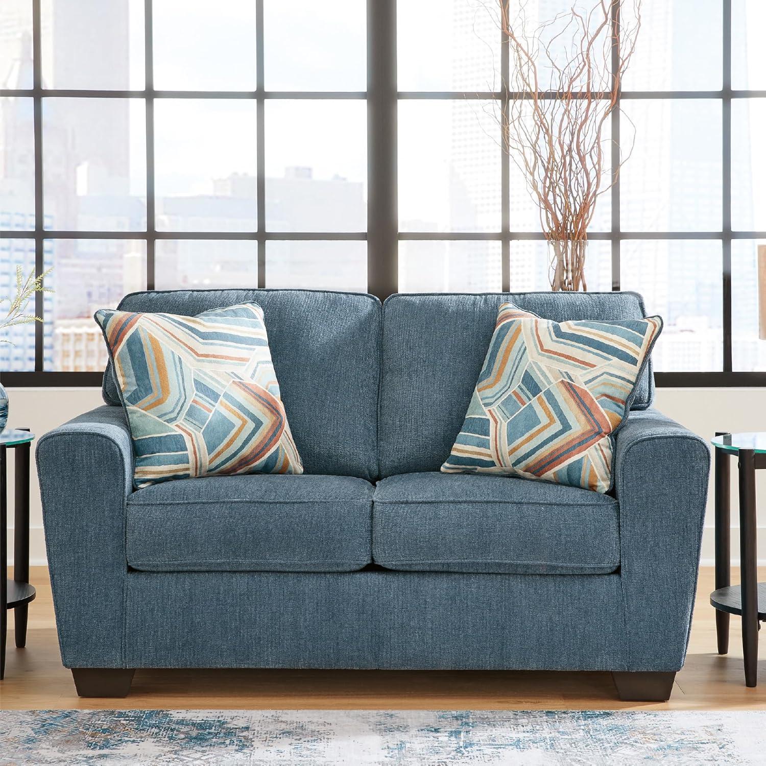 imageSignature Design by Ashley Cashton Contemporary Loveseat Exposed Feed With Faux Wood Finish Accent Pillows Fabric Upholstery 63quot W x 38quot D x 39quot H BlueBlue