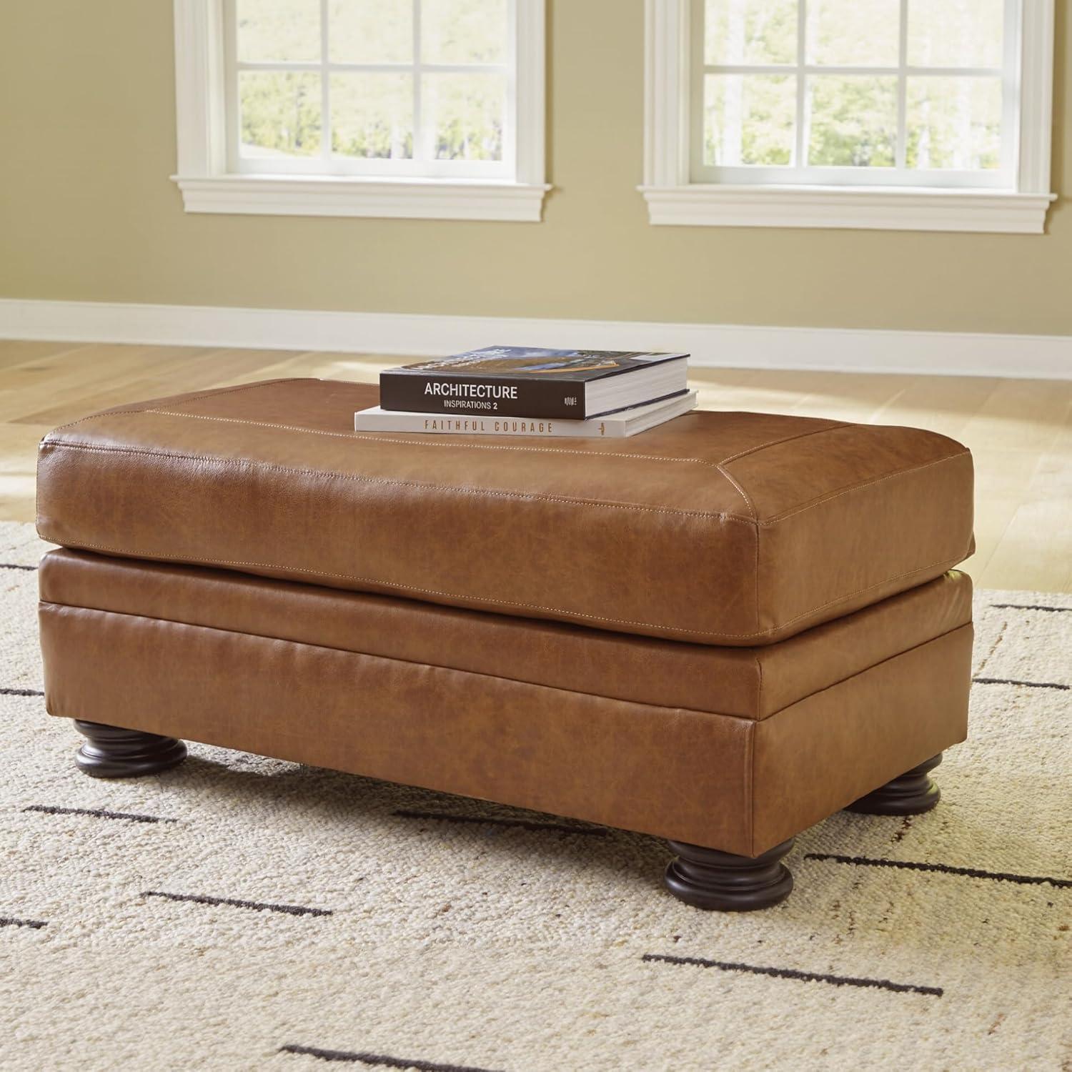 imageSignature Design by Ashley Carianna Traditional Firmly Cushioned Leather Rectangular Ottoman with Decorative Turn Legs Brown